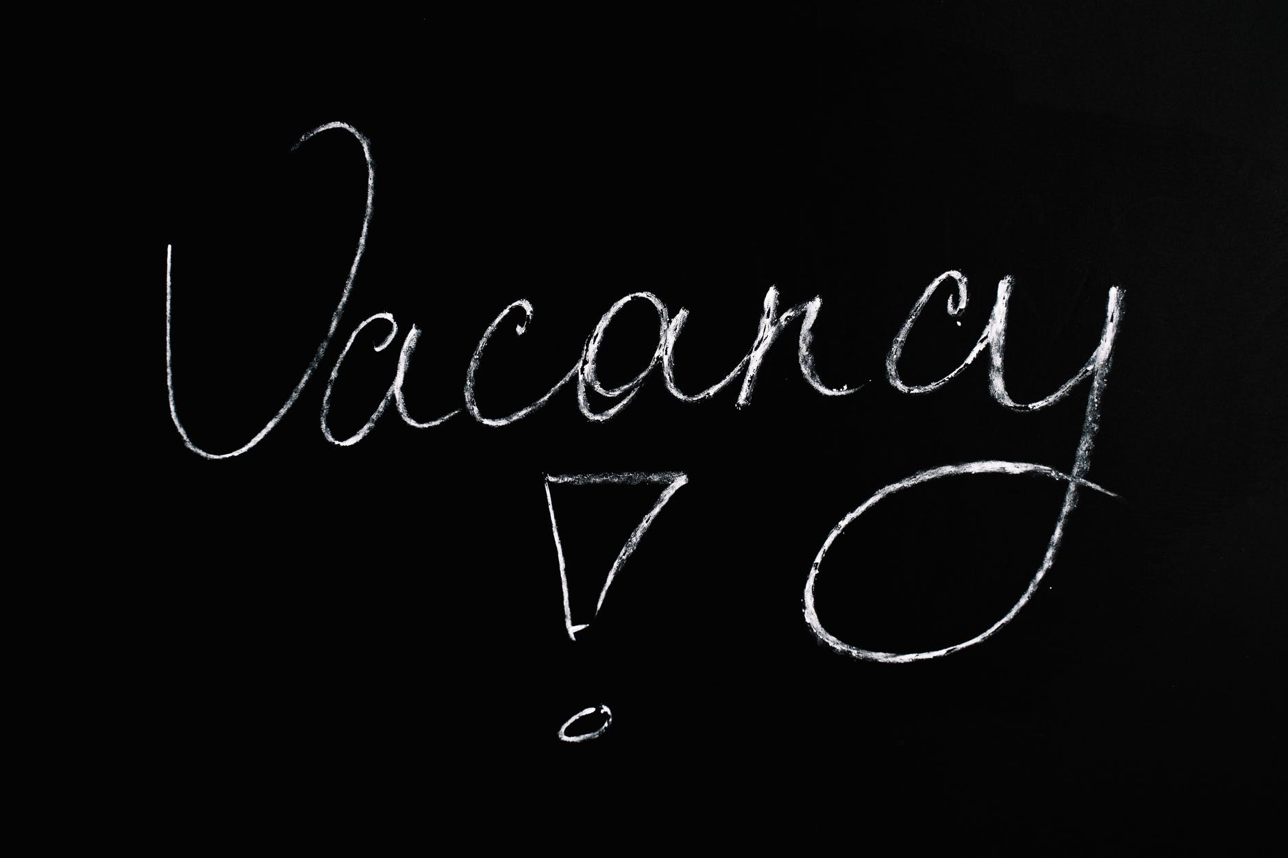 vacancy lettering text on black background